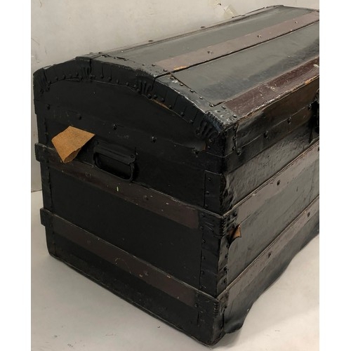 9243 - A dome topped trunk with 2 brass carrying handles, hinged lid (no tray to interior), 84cm wide, 49cm... 