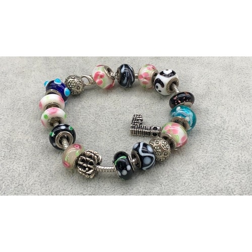 9246 - A Pandora charm bracelet with circular charms