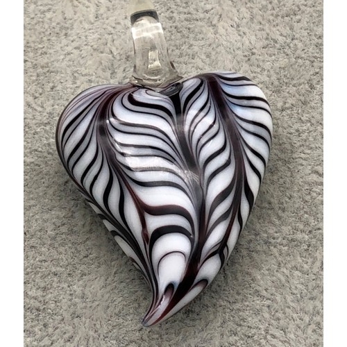 9247 - A Murano glass heart shaped pendant on white and purple ground, 5cm high