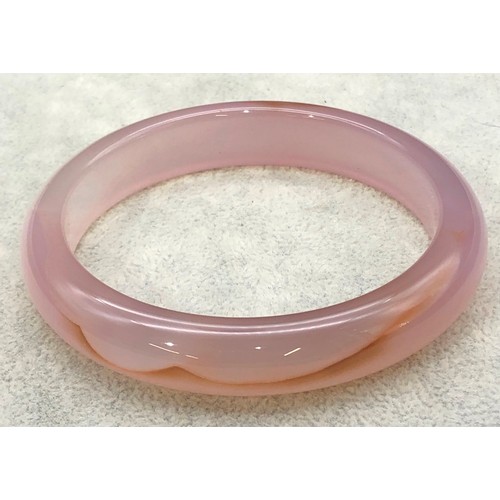 9250 - A pink jade style bangle, 8cm diameter