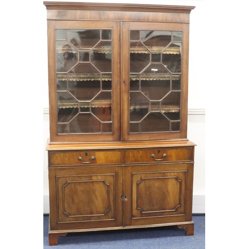 9284 - A George III mahogany bookcase with 2 astragal glass doors enclosing leather fronted adjustable shel... 