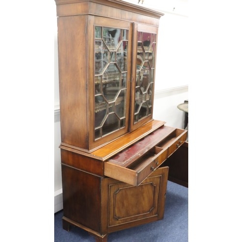 9284 - A George III mahogany bookcase with 2 astragal glass doors enclosing leather fronted adjustable shel... 