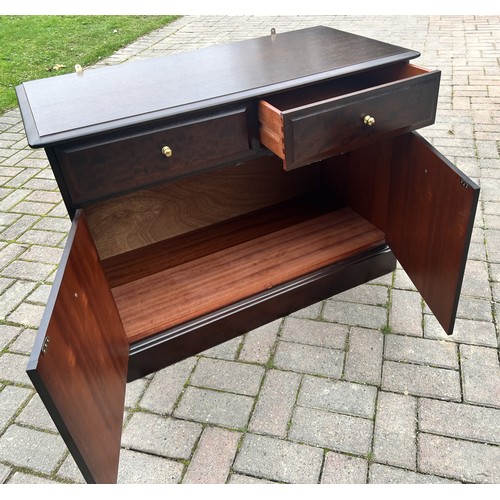 9277 - A Stag Minstrel low cupboard with 2 drawers and 2 panel doors, with label, 72cm high, 96cm wide, 46c... 