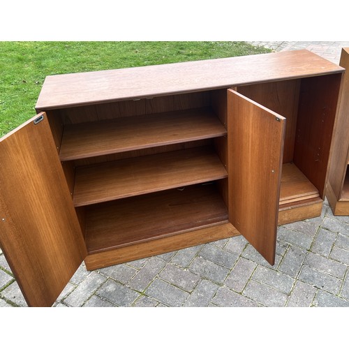 9275 - 2 Minty (Oxford) teak cupboards, 130cm wide, 38cm deep, 88cm high. This item is held in storage, ple... 