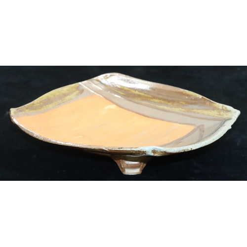 1 - A glazed Slipware square Studio pottery dish by Ruthanne Tudball (b. 1948) on 3 splayed feet, indist... 