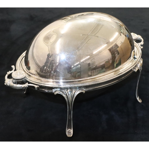 127 - A silver plated oval 2-handled breakfast dish with swivel top enclosing liner, on 4 splayed legs, 33... 