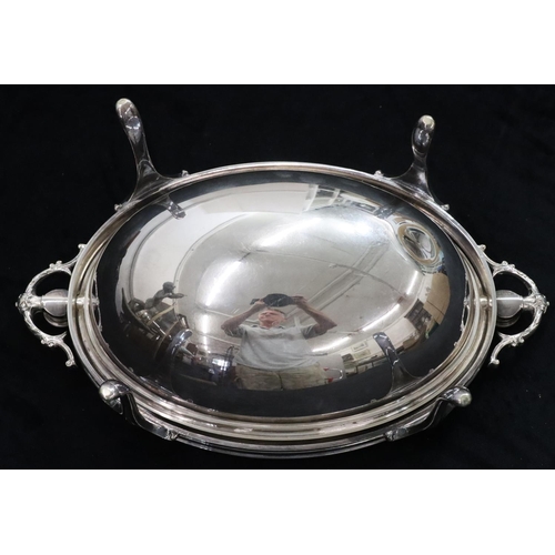 127 - A silver plated oval 2-handled breakfast dish with swivel top enclosing liner, on 4 splayed legs, 33... 