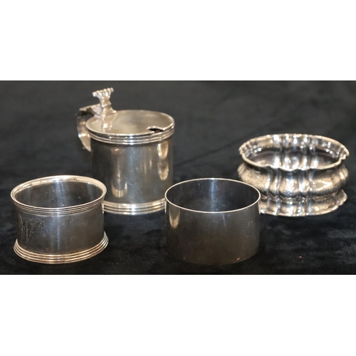 136 - A George VI plain silver mustard pot with hinged lid and blue glass liner, London 1938 and a silver ... 