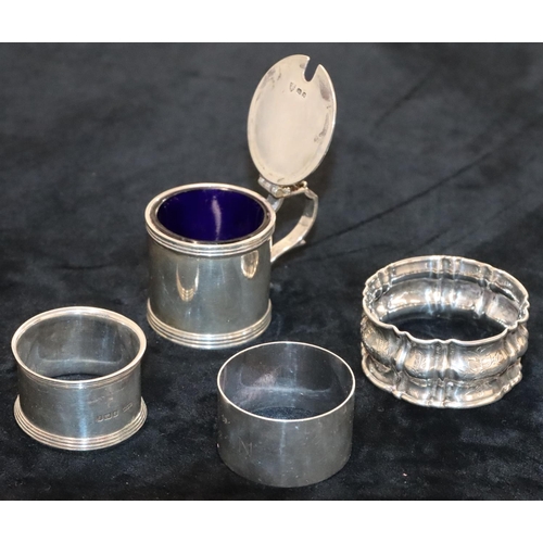 136 - A George VI plain silver mustard pot with hinged lid and blue glass liner, London 1938 and a silver ... 