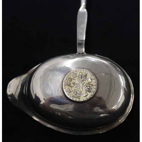 138 - A Georgian silver coloured metal toddy ladle set with 18th Century silver coin with twist bone handl... 