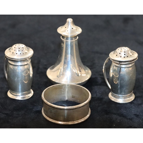 142 - A pair of Birmingham silver round bulbous shaped pepper pots, another Birmingham silver round pepper... 