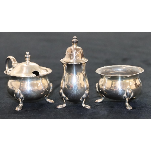 143 - A 3-piece Birmingham silver round bulbous shaped condiment set, comprising of mustard with blue glas... 