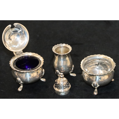 143 - A 3-piece Birmingham silver round bulbous shaped condiment set, comprising of mustard with blue glas... 