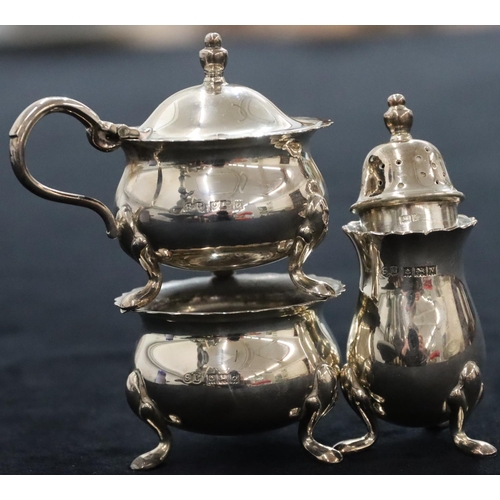 143 - A 3-piece Birmingham silver round bulbous shaped condiment set, comprising of mustard with blue glas... 