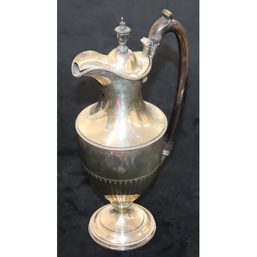 145 - A late Victorian silver round bulbous thin necked water jug with hinged lid and ebonised handle and ... 