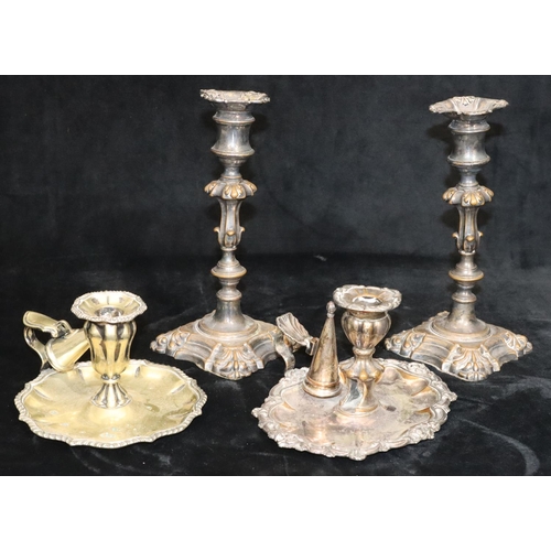 149 - A pair of silver plated candlesticks on turned stems with square scallop shaped bases, 23.5cm high a... 