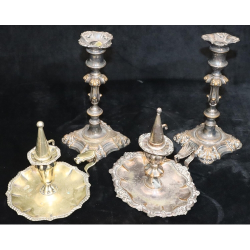 149 - A pair of silver plated candlesticks on turned stems with square scallop shaped bases, 23.5cm high a... 