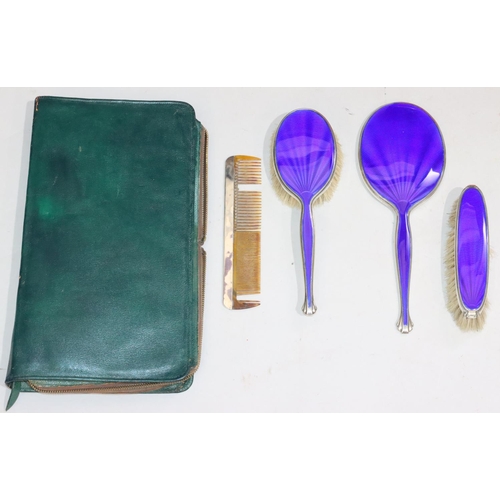 152 - A George V silver and blue enamelled 4-piece dressing table set, comprising of hand mirror, 2 brushe... 