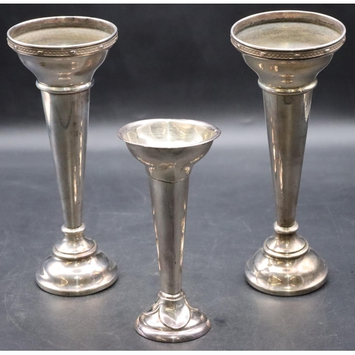 168 - A pair of London silver round trumpet shaped spill vases (weighted bases in need of restoration) and... 