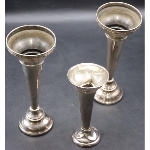 168 - A pair of London silver round trumpet shaped spill vases (weighted bases in need of restoration) and... 