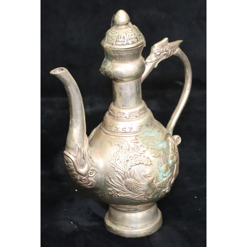 172 - A Tibetan silver plated round bulbous shaped coffee pot with raised dragon and phoenix decoration, 2... 