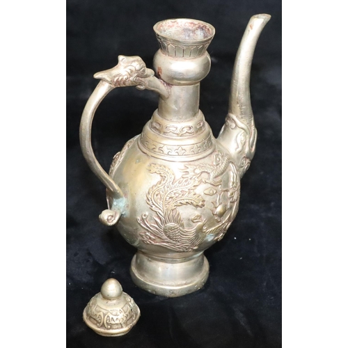 172 - A Tibetan silver plated round bulbous shaped coffee pot with raised dragon and phoenix decoration, 2... 