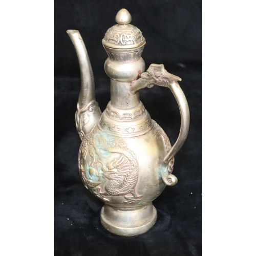 172 - A Tibetan silver plated round bulbous shaped coffee pot with raised dragon and phoenix decoration, 2... 