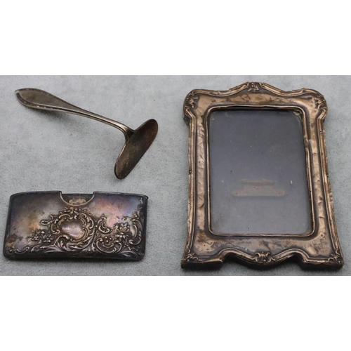 178 - A Birmingham silver concaved shaped card case with embossed floral, leaf and scroll decoration, a Bi... 