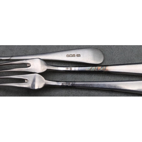 184 - A Sheffield silver pickle fork and a pair of 800 silver coloured metal pickle forks, 2.6oz gross (3)