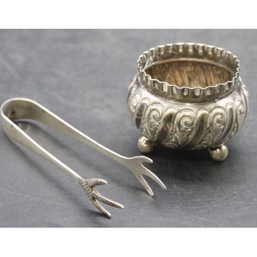 187 - A small Sheffield silver round bulbous shaped salt with crinkled rim and embossed scroll decoration,... 