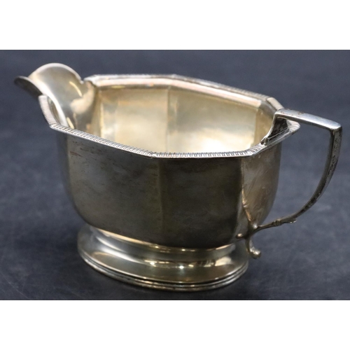 189 - A Birmingham silver milk jug with chamfer decoration, on oval sweeping base, 5.3oz