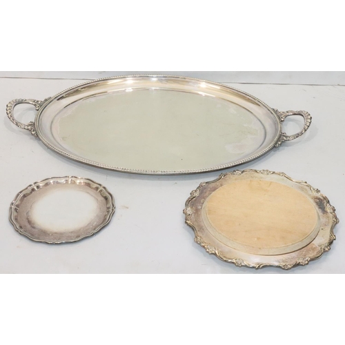 194 - A silver plated oval 2-handled tray with gadroon rim, 67.5cm wide (worn), a silver plated round scal... 