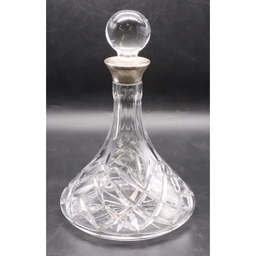 209 - A cut glass round ship's decanter with stopper and Birmingham silver neck, 27cm high