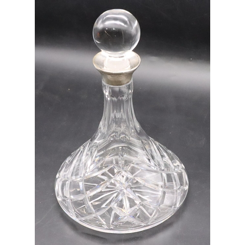 209 - A cut glass round ship's decanter with stopper and Birmingham silver neck, 27cm high