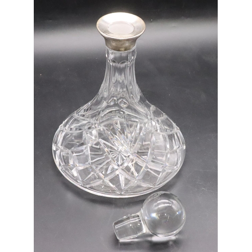 209 - A cut glass round ship's decanter with stopper and Birmingham silver neck, 27cm high