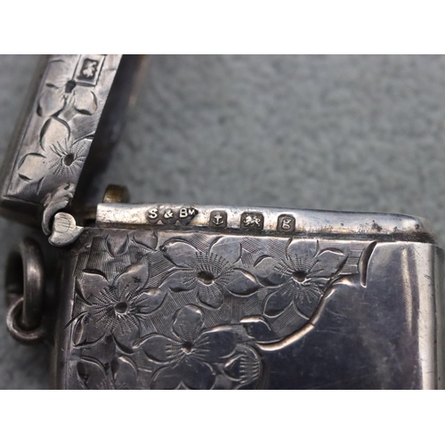 217 - A rectangular Birmingham silver vesta case with part bright cut floral decoration, maker's mark S & ... 