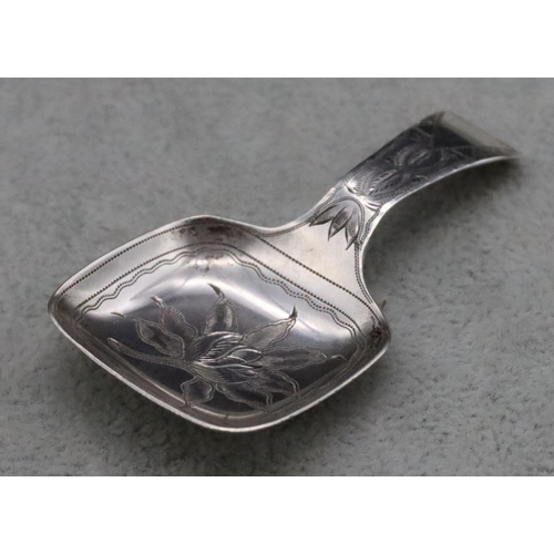 220 - An American Sterling silver 19th Century caddy spoon with bright cut decoration, maker Daniel Low & ... 