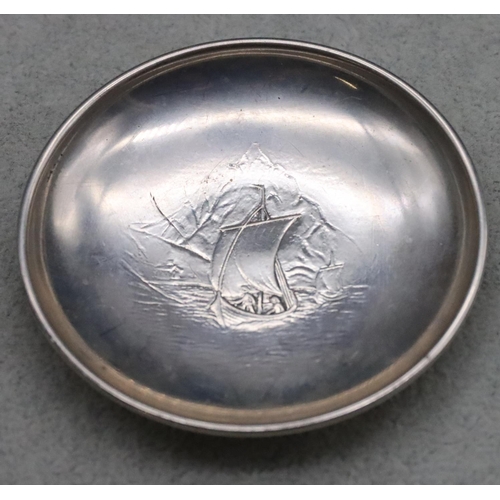 224 - An 830 Scandinavian silver coloured metal small round dish with embossed sailing boat motif, 7.2cm d... 