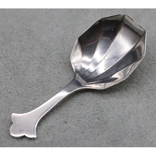 225 - A Sheffield silver caddy spoon with fluted bowl, maker's mark CB & S