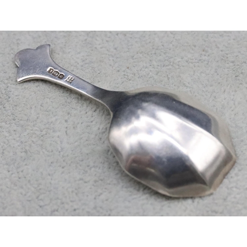 225 - A Sheffield silver caddy spoon with fluted bowl, maker's mark CB & S