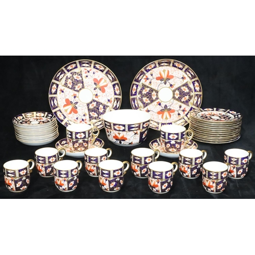 23 - A Royal Crown Derby Imari pattern tea service, comprising of slop bowl, pair of cake plates, 10 cups... 