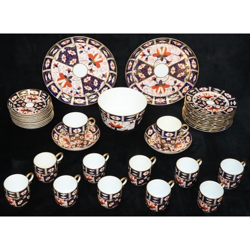 23 - A Royal Crown Derby Imari pattern tea service, comprising of slop bowl, pair of cake plates, 10 cups... 