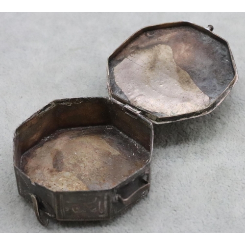 231 - A small Eastern octagonal shaped 2-handled snuff box with allover engraved decoration and hinged lid... 