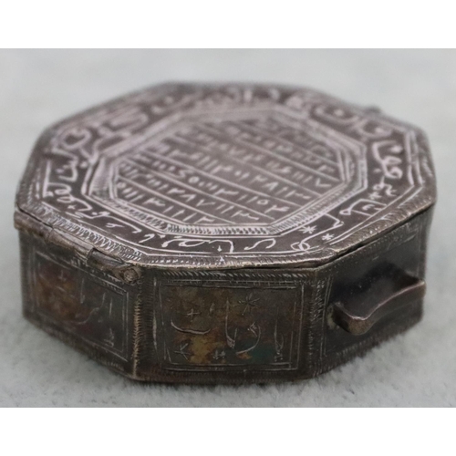 231 - A small Eastern octagonal shaped 2-handled snuff box with allover engraved decoration and hinged lid... 