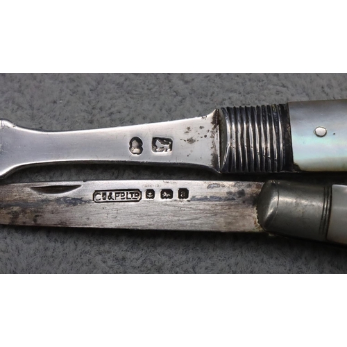 232 - A Georgian silver and Mother of Pearl folding penknife fork and another Birmingham silver and Mother... 