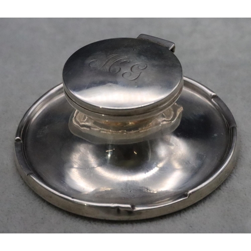 235 - A Birmingham silver round inkwell with hinged lid and sweeping base, 9cm diameter