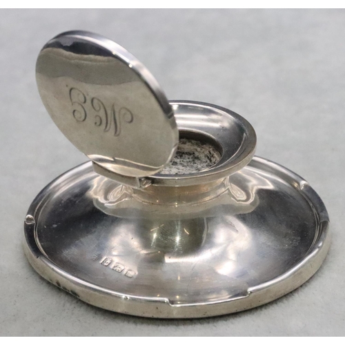 235 - A Birmingham silver round inkwell with hinged lid and sweeping base, 9cm diameter