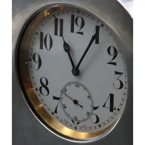 239 - A Continental silver coloured metal timepiece holder, 19cm wide including Goliath pocket watch with ... 