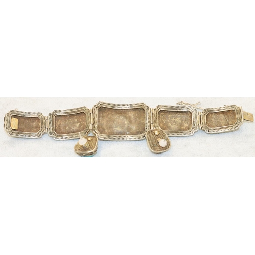 252 - An Oriental silver gilt 5-panel bracelet with turquoise centres  surrounded by turquoise and blue en... 