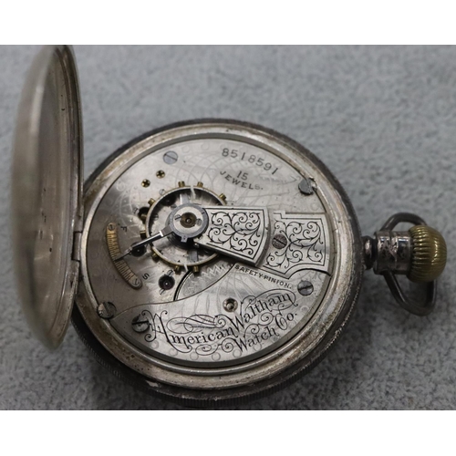 253 - An American Waltham Watch Co. silver open faced pocket watch with white enamel dial and seconds dial... 